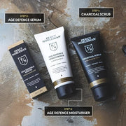 Age Defence Kit, a men's skincare set containing Charcoal Face Scrub (with Natural AHAs), ultra-hydrating Facial Serum (wi...