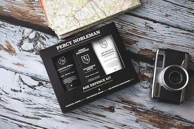 Age Defence Kit, a men's skincare set containing Charcoal Face Scrub (with Natural AHAs), ultra-hydrating Facial Serum (wi...