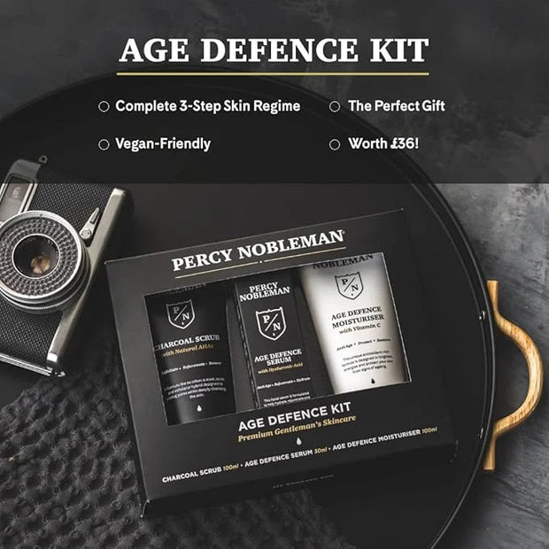 Age Defence Kit, a men's skincare set containing Charcoal Face Scrub (with Natural AHAs), ultra-hydrating Facial Serum (wi...