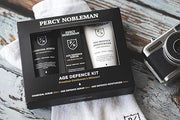 Age Defence Kit, a men's skincare set containing Charcoal Face Scrub (with Natural AHAs), ultra-hydrating Facial Serum (wi...