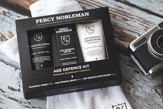 Age Defence Kit, a men's skincare set containing Charcoal Face Scrub (with Natural AHAs), ultra-hydrating Facial Serum (wi...